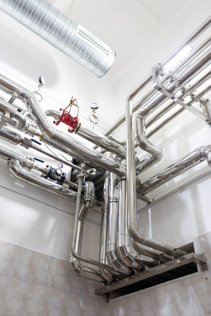 Steel Pipelines And Cables In Factory Interior As Industrial Zone Background Concept